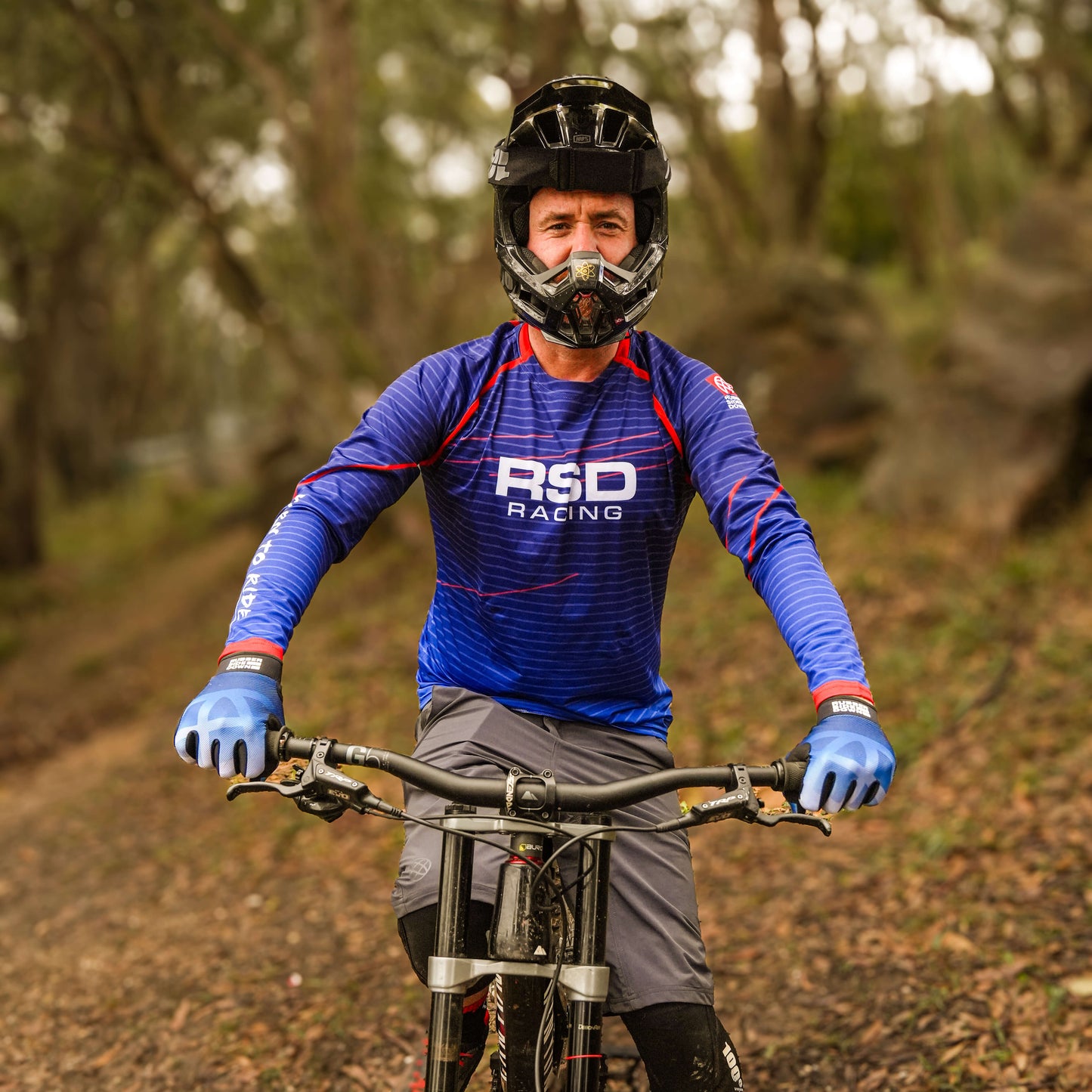 [Blue] Male rider in blue RSD kit on mountain bike trail